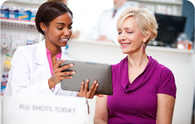 Pharmacist explaining about medication using tablet to the old woman