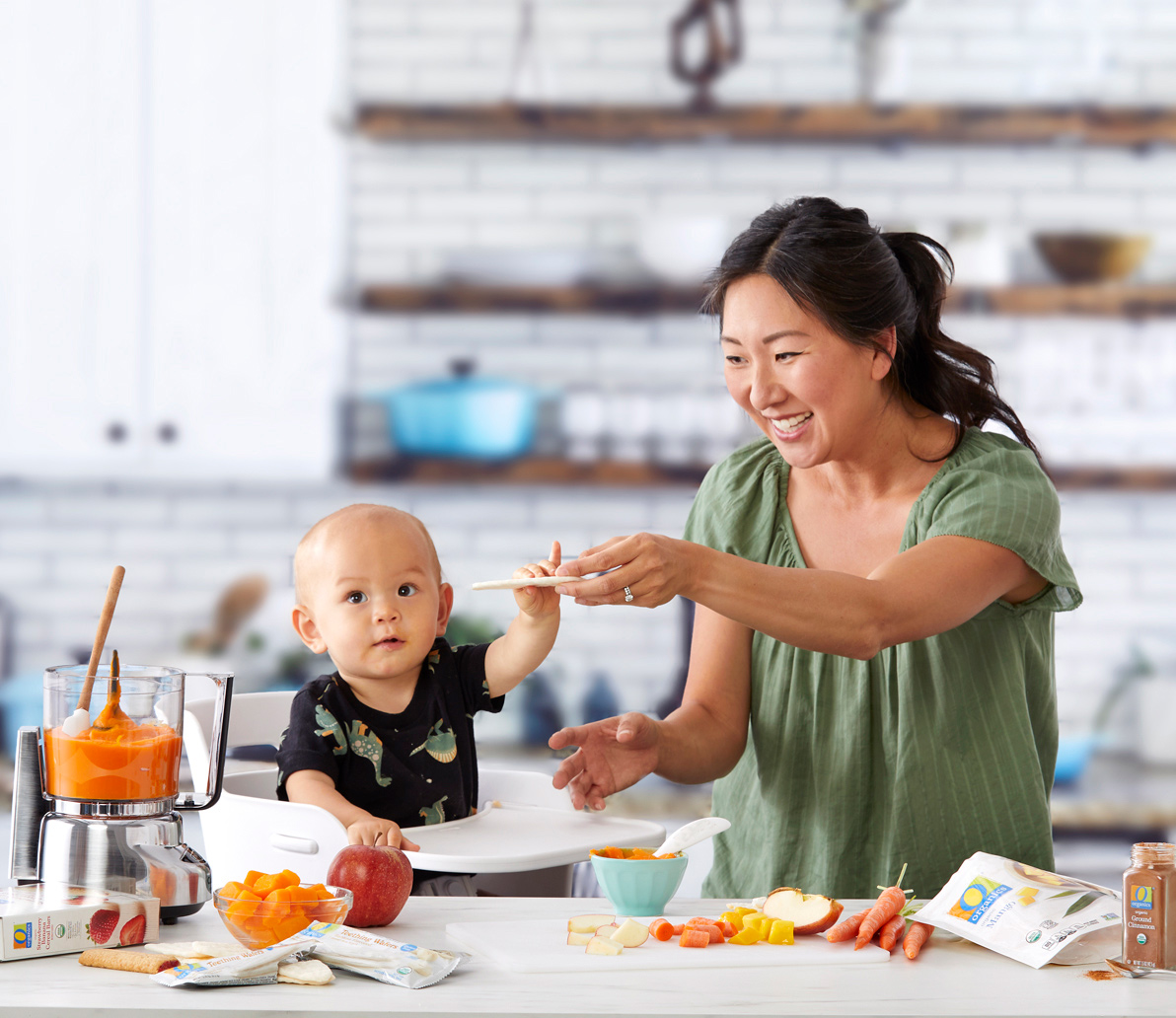 Mom and baby having fun with O Organics fruits and veggies